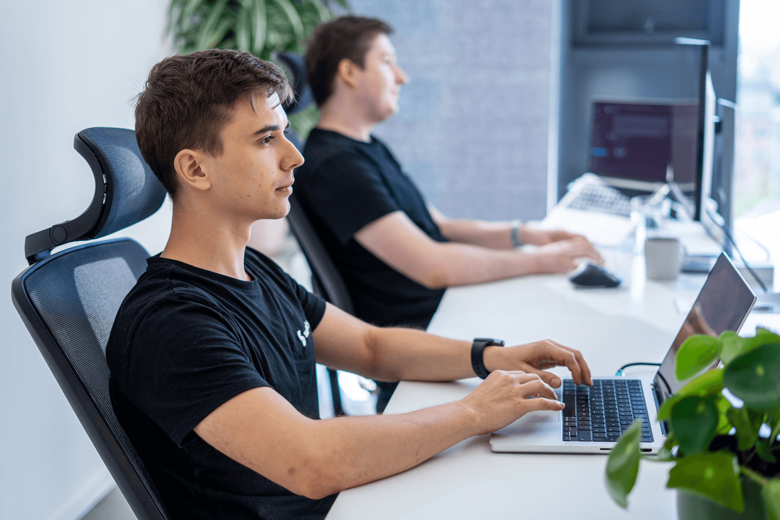 Erik Kandalík and Tomáš Kuchárik, data scientists, collaborating at work