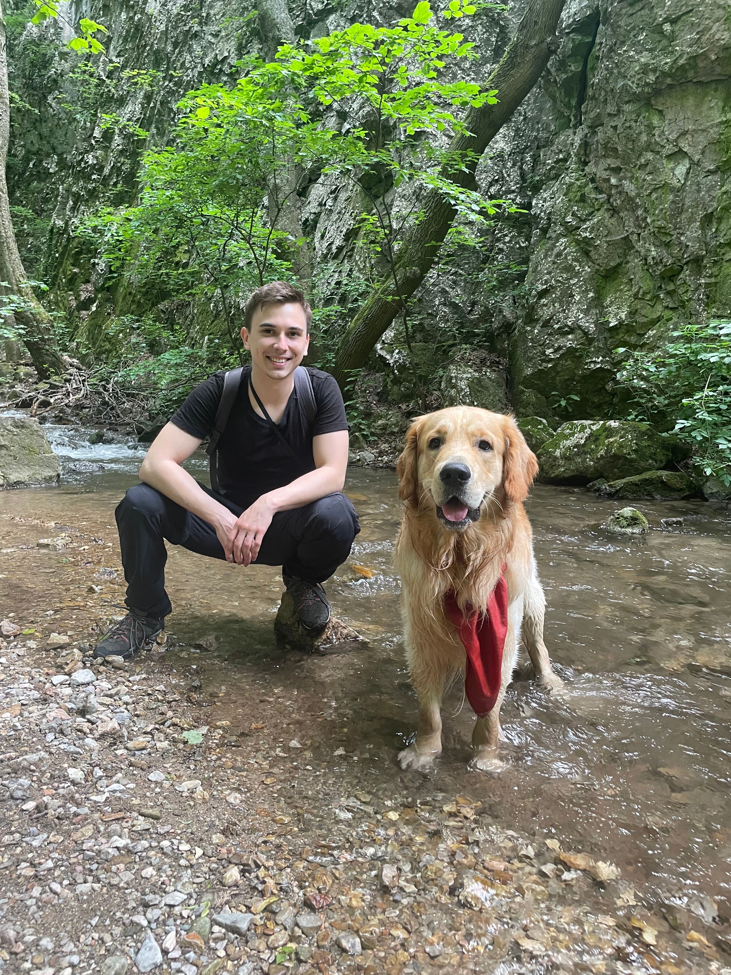 Erik Kandalík and his loyal Golden Retriever, Gaston, enjoying a peaceful moment in nature