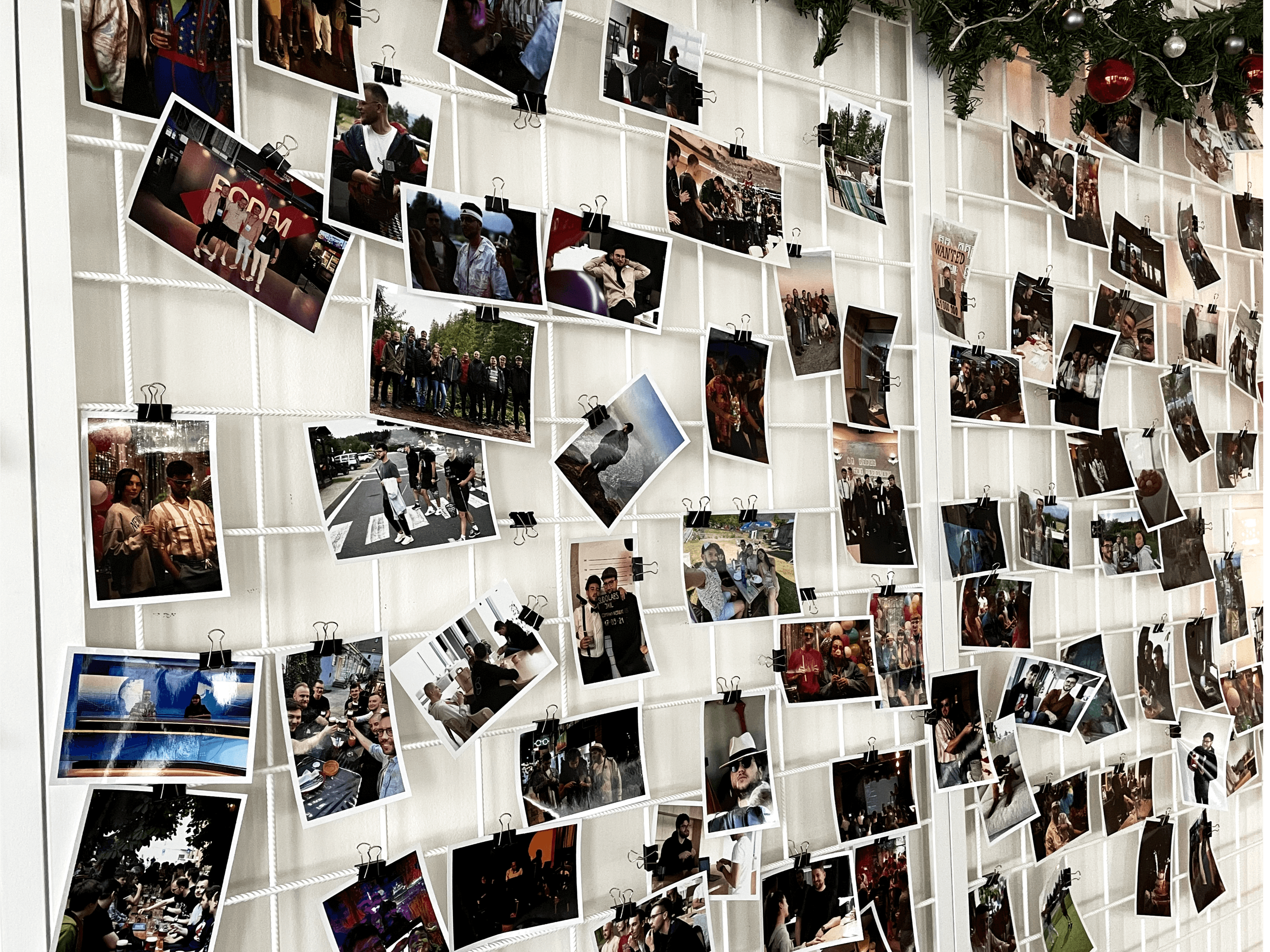Sudolabs office wall decorated with picture from company events