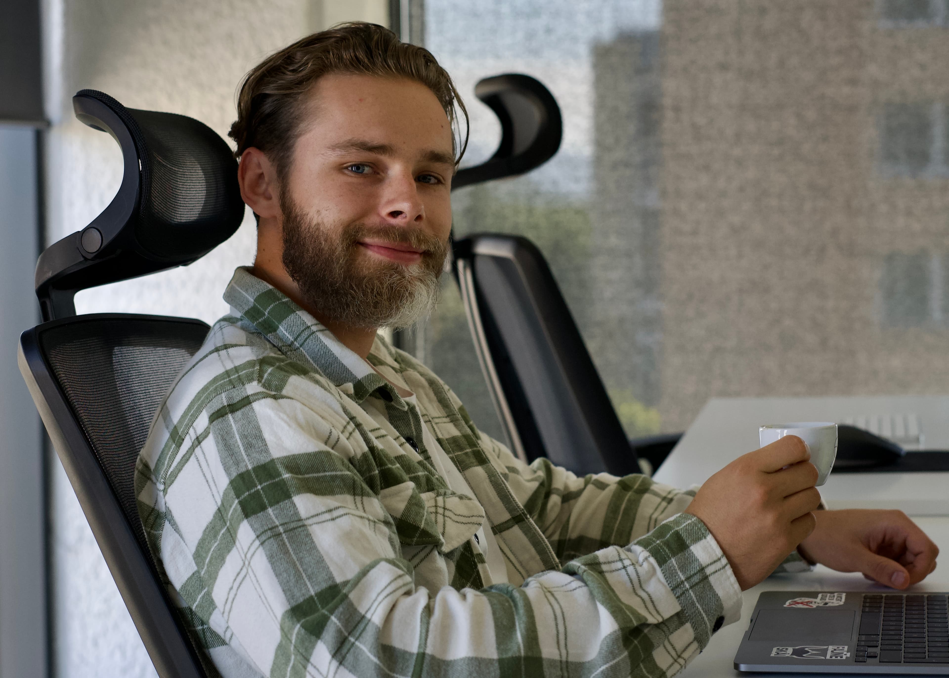 Andrej, our developer, enjoying a well-deserved cup of coffee after a call with the client The Expert