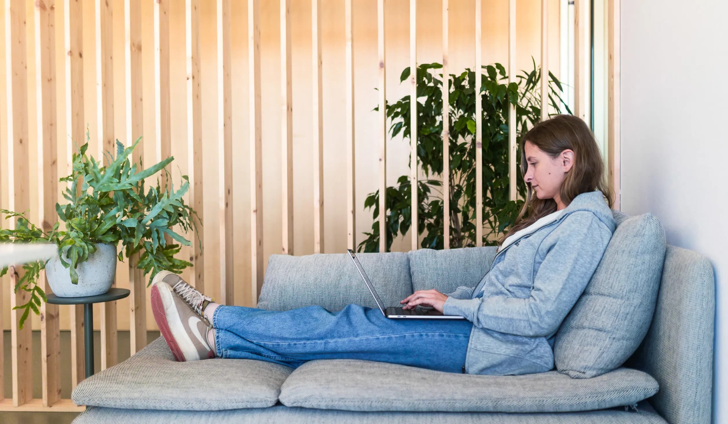 Sudolabs team member working on a laptop
